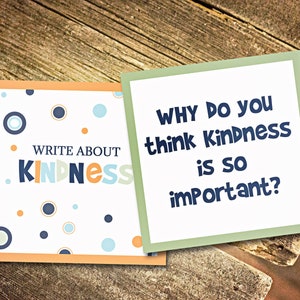 May include: Two cards with a white background and colorful polka dots. The first card says "Write About Kindness" in blue, orange, and yellow letters. The second card says "Why do you think Kindness is so important?" in blue letters.