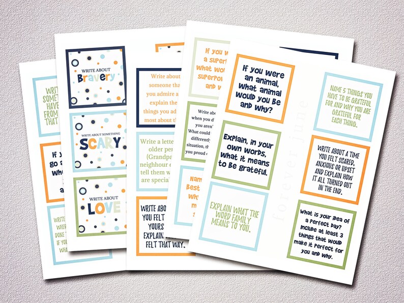May include: A set of colorful printable cards with prompts for writing activities. The cards feature a variety of themes, including bravery, scary, love, family, and gratitude. Each card has a different color scheme and design.
