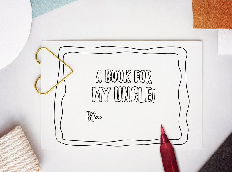 May include: A blank white card with a black border, a gold heart-shaped paper clip, and a red pen. The card has the text "A book for my uncle! By~" printed on it.