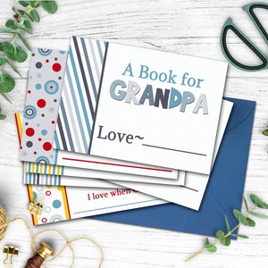 May include: A book for Grandpa with a blue, gray, and red striped cover. The book has a blank space for a name and the words "Love~" above it.