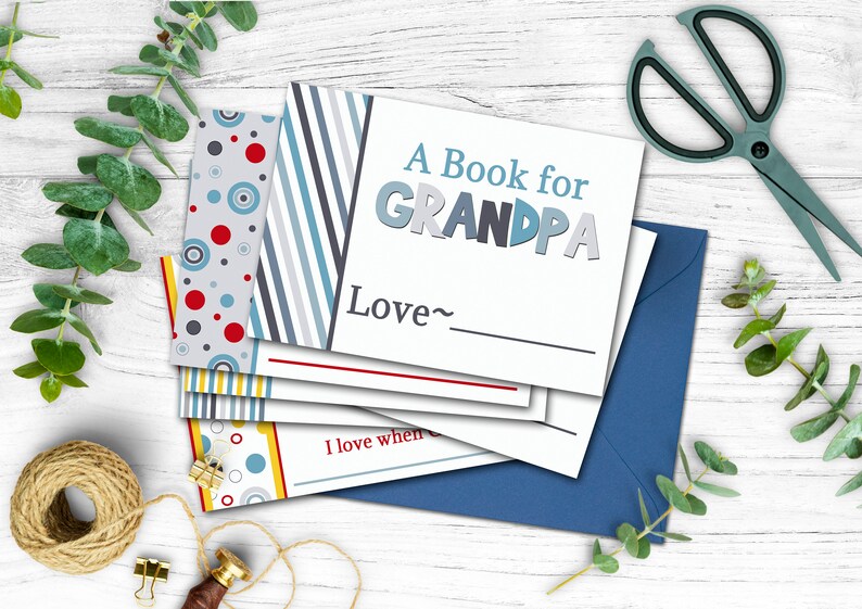 May include: A book for Grandpa with a blue, gray, and red striped cover. The book has a blank space for a name and the words "Love~" above it.