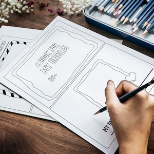 May include: A blank book with the title "A Book for My Uncle!" and the words "By:___" written on the cover. A person is drawing a heart in a frame on the page.
