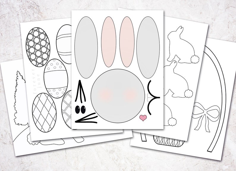 May include: A printable Easter craft activity with black and white outlines of a bunny, eggs, a basket, and a bow. The bunny has pink ears and a gray face.