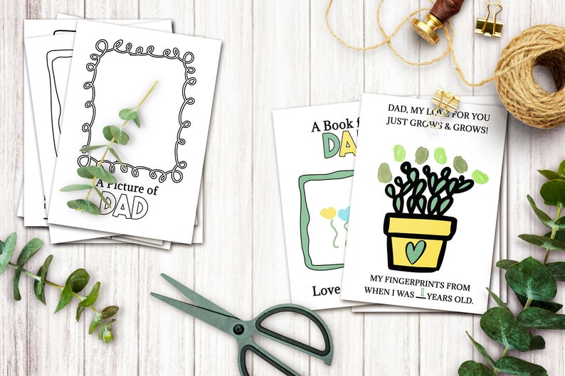 May include: Three printable cards for Father's Day. The first card is a black and white outline of a picture frame with the text "A picture of Dad". The second card has a green and blue outline of a picture frame with the text "A Book for Dad". The third card has a green plant in a yellow pot with a heart on the side and the text "Dad, my love for you just grows & grows! My fingerprints from when I was _ years old."
