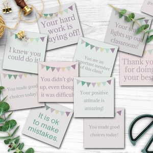 May include: A set of ten colorful encouragement cards with a bunting design. The cards have positive messages for students, such as "You made good choices today!" and "Your hard work is paying off!"