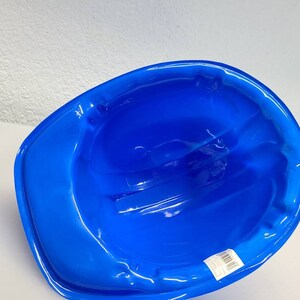 May include: A blue plastic construction worker helmet. The helmet is designed for safety and is made of durable plastic.