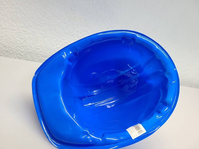 May include: A blue plastic construction worker helmet. The helmet is designed for safety and is made of durable plastic.