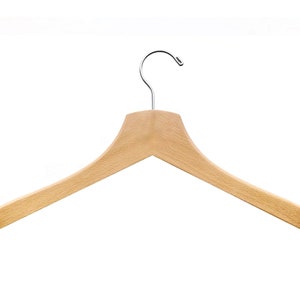 May include: A wooden clothes hanger with a chrome hook.