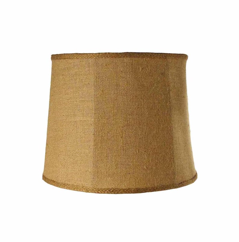 May include: A brown burlap lampshade with a rope trim.