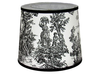 May include: Black and white toile lampshade with a black trim. The lampshade features a scene of people in a garden setting.