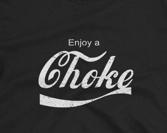 May include: Black t-shirt with a white vintage-style graphic that says "Enjoy a Choke"