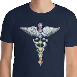 May include: A navy blue t-shirt with a white caduceus symbol with a rainbow of colors representing the seven chakras.