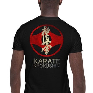 May include: Black t-shirt with a red and gold karate symbol and the text "KARATE KYOKUSHIN".