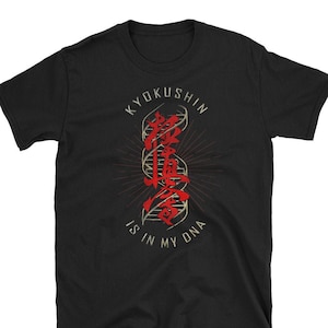 May include: Black t-shirt with a gold and red graphic design. The graphic features the Japanese characters for "Kyokushin" and a stylized DNA strand. The text "is in my DNA" is written below the graphic.