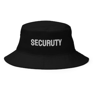 May include: Black bucket hat with the word "SECURITY" embroidered in white on the front.
