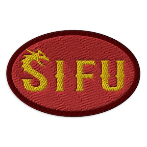 Peut inclure: Écusson brodé ovale rouge avec un dragon doré et le mot "SIFU" en lettres dorées.