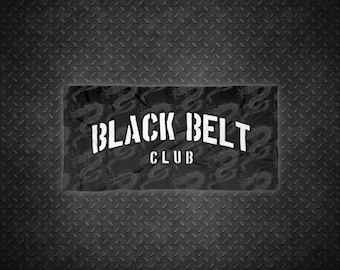 May include: Black and white graphic design with a black background and white text that reads "Black Belt Club" with a dragon pattern.