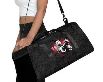 May include: Black duffel bag with a black and white wave pattern and a red and white graphic of a man with the text "IP MAN" on it.