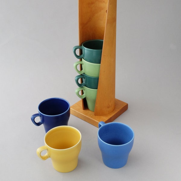 Seven Swedish ceramic Höganäs mugs piled in an original Höganäs rack  1990s Scandinavian design. Original X-mas gift