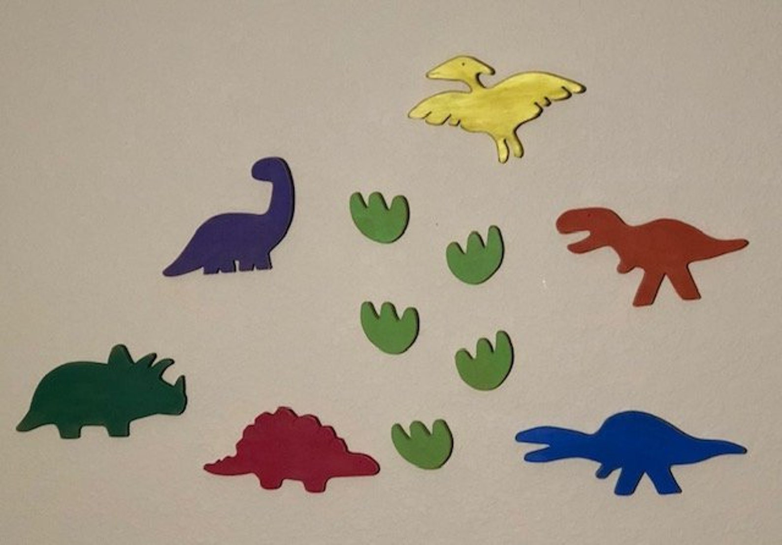 painted wooden dinosaur cutouts
