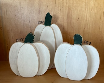 White wooden pumpkin trio