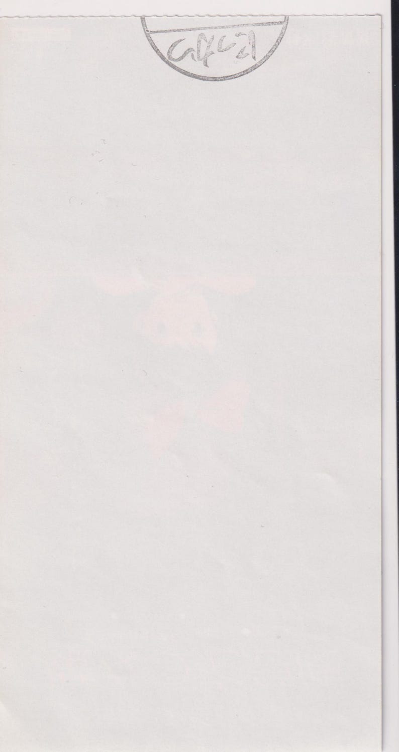 May include: A white paper with a faded pink floral design. The top right corner has a gray, semi-circular stamp with the handwritten text "G4021". The paper is slightly creased.