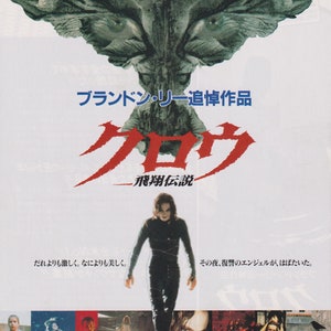 May include: A movie poster for the film "The Crow: City of Angels" featuring a black and white image of a crow with its wings spread wide. The poster also features the text "The Crow: City of Angels" and the tagline "The Crow: City of Angels".