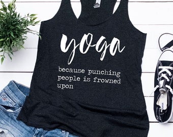 May include: Black tank top with the text "yoga because punching people is frowned upon" in white lettering.