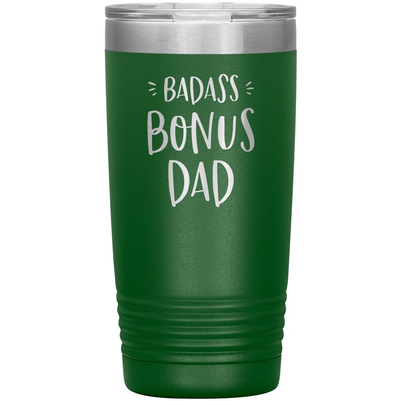 May include: A green stainless steel tumbler with a white inscription that reads "Badass Bonus Dad".