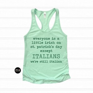 May include: A light green racerback tank top with the text "everyone is a little irish on st. patrick's day except ITALIANS we're still italian". The tank top has a scoop neck and is made of a soft material.