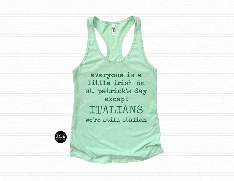 May include: A light green racerback tank top with the text "everyone is a little irish on st. patrick's day except ITALIANS we're still italian". The tank top has a scoop neck and is made of a soft material.