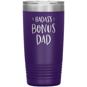 May include: Purple stainless steel tumbler with a white inscription that reads "Badass Bonus Dad".