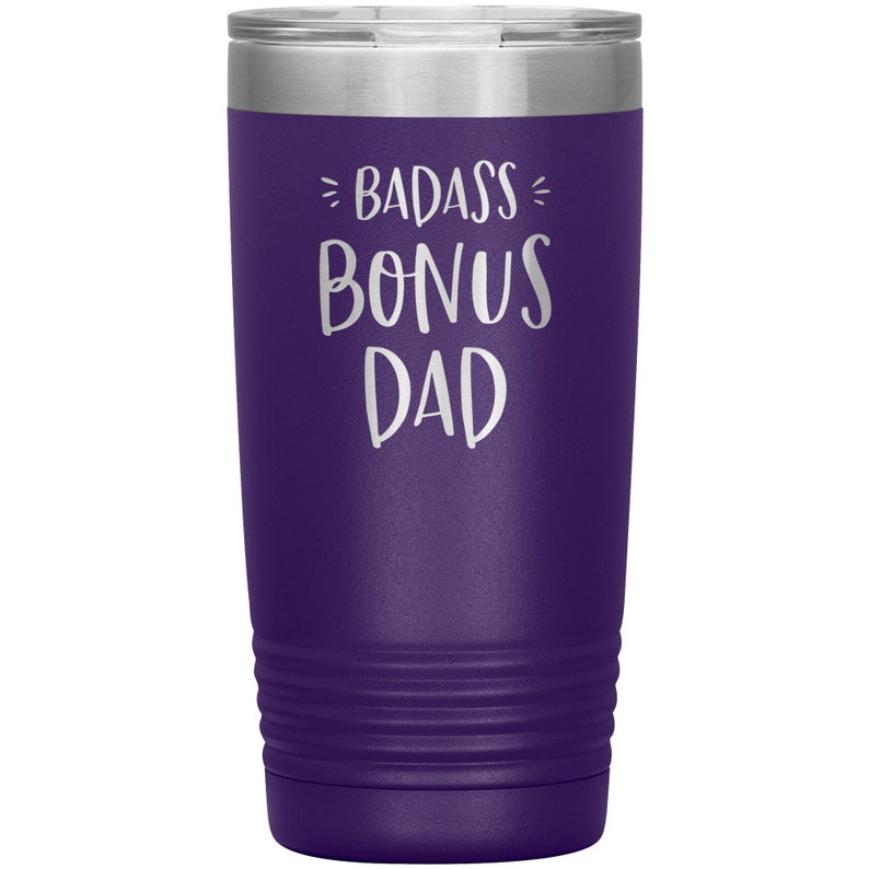 May include: Purple stainless steel tumbler with a white inscription that reads "Badass Bonus Dad".