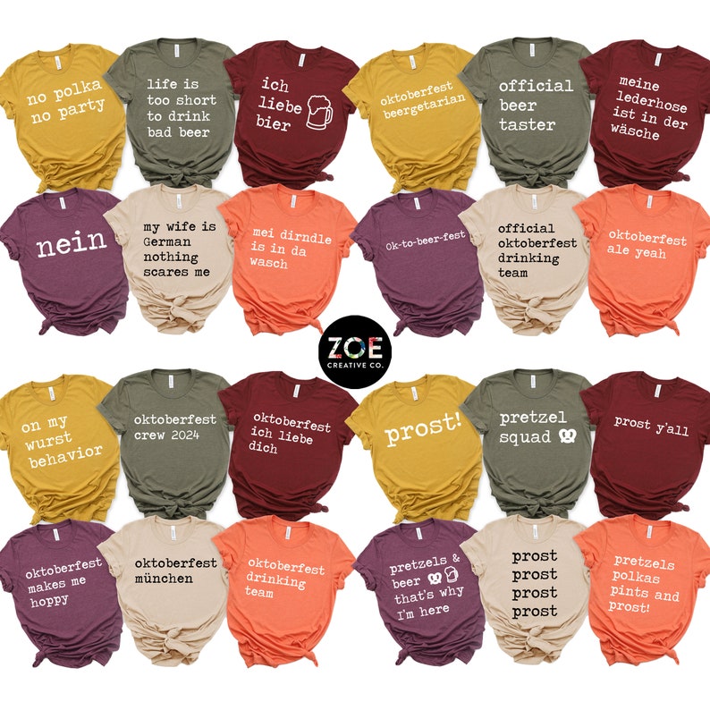May include: A selection of colourful t-shirts with Oktoberfest slogans and designs. The shirts display phrases such as "Prost!", "Oktoberfest", and "Pretzel Squad". The Zoe Creative Co. logo is visible on the shirts.
