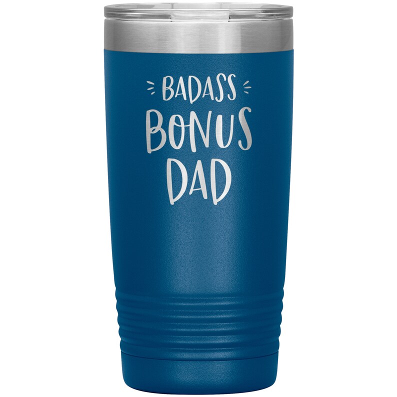 May include: A blue stainless steel tumbler with the text "Badass Bonus Dad" in white lettering.