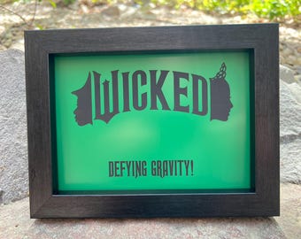 Wicked, plaque Wicked, défiant la gravité, empreinte de main sur mon coeur, changé pour de bon, comédie musicale Wicked, film Wicked, art méchant, panneau méchant