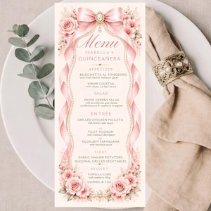 May include: A vertical menu card for Isabella's Quinceañera featuring a soft cream background, pink floral illustrations, and a large pink ribbon bow at the top. The text lists appetizers, salad, entrées, sides, and dessert in dark brown font.