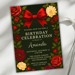 May include: A birthday celebration invitation with a dark green background, adorned with red roses, dahlias, and a large red bow. The text reads "PLEASE JOIN US FOR A BIRTHDAY CELEBRATION in Honor of Amanda". Details include the date, time, and location.
