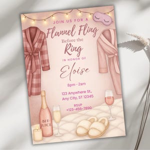 May include: A blush-toned invitation for a 'Flannel Fling' bachelorette party, featuring watercolor illustrations of robes, champagne, slippers, and a sleep mask. The invitation includes the text 'Join us for a Flannel Fling Before the Ring in honor of Eloise'.