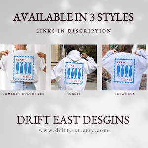 May include: Image features three clothing styles: a white Comfort Colors tee, a white hoodie, and a gray crewneck. Each garment displays a blue stamp design with fish and the word "CIAO". Text reads "AVAILABLE IN 3 STYLES" and "DRIFT EAST DESGINS".