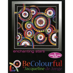 May include: A colourful quilt pattern featuring a repeating design of stars and circles. The quilt is made with a variety of fabrics in shades of red, orange, yellow, green, blue, and purple. The quilt is set against a black background. The title of the quilt pattern is "Enchanting Stars" and the designer is "BeColourful by Jacqueline de Jonge". All foundation papers are included.