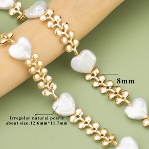 May include: A gold chain bracelet with irregular natural pearls in heart shapes. The pearls are approximately 12.6mm by 11.7mm. The chain is 8mm wide.