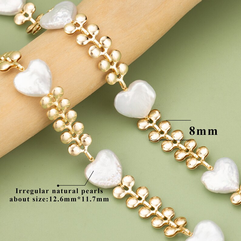 May include: A gold chain bracelet with irregular natural pearls in heart shapes. The pearls are approximately 12.6mm by 11.7mm. The chain is 8mm wide.
