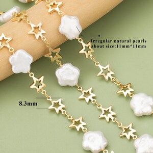 May include: Gold chain necklace with irregular natural pearls and star-shaped charms. The pearls are approximately 11 mm in size. The chain is 8.3 mm wide.