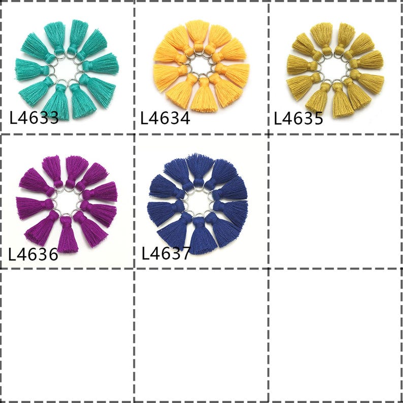 May include: Assortment of 10 small tassel keychains in six different colors: teal, yellow, mustard, purple, navy blue, and white. Each keychain is made of a single tassel with a silver ring.