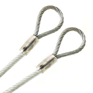 May include: Two silver wire rope thimbles with loops at the ends. The thimbles are used to protect wire rope from wear and tear.
