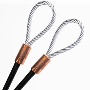 May include: Two silver wire loops with copper ends. The wire loops are connected to black cords.