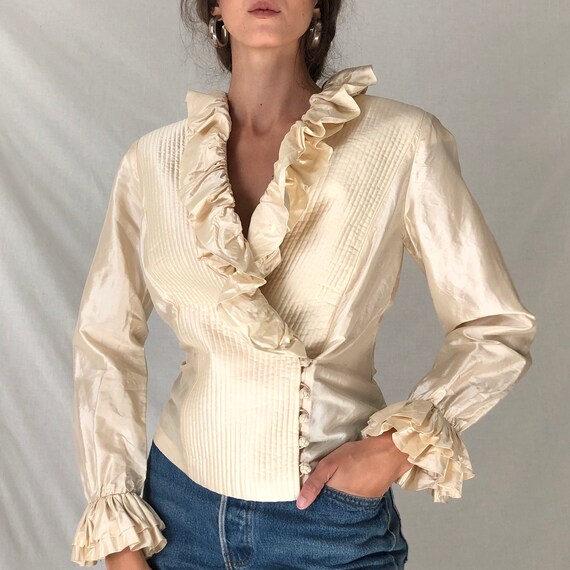 cream frilly blouse