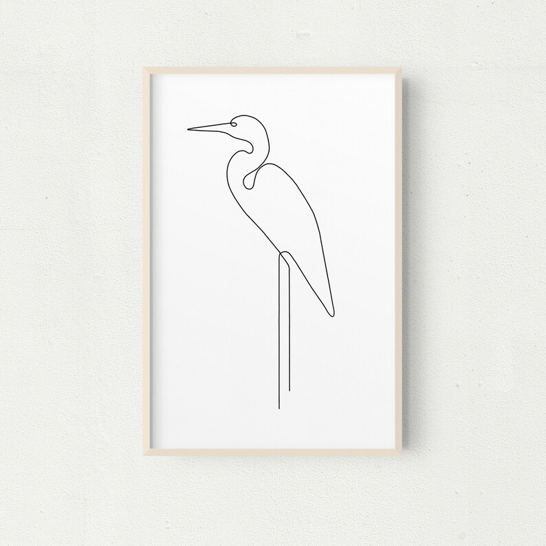 May include: A black and white line drawing of a heron standing on one leg on a branch. The heron is facing to the right and has a long neck and beak.