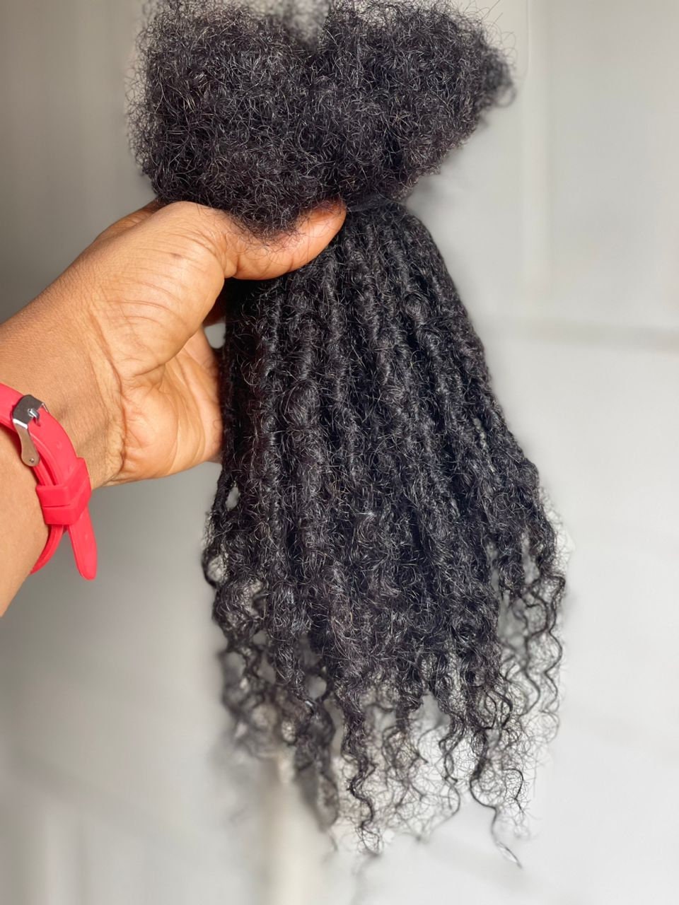 100 Strands of Anwi Curly tips human hair loc extensions in sizes 0.6-0.7cm